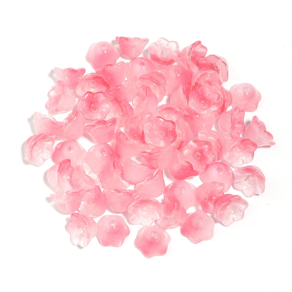 A pile of pink cherry blossom flower glass beads for jewelry making