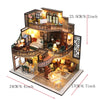 A detailed miniature dollhouse puzzle kit featuring a two-story wooden structure with interior furniture and decorative eleme