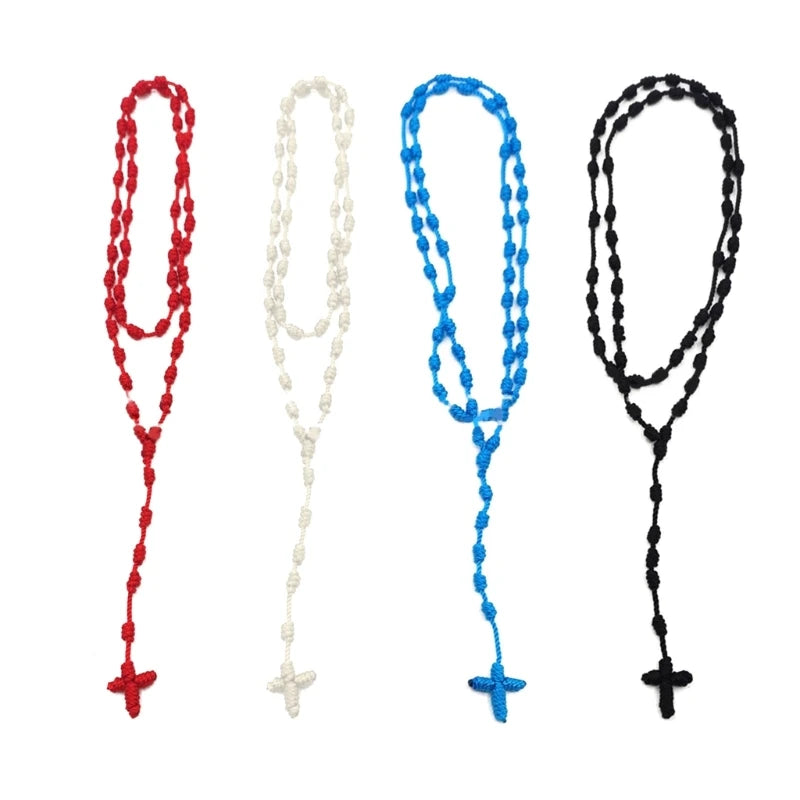 Three handmade knotted rosary necklaces in red, white, and blue with cross charms