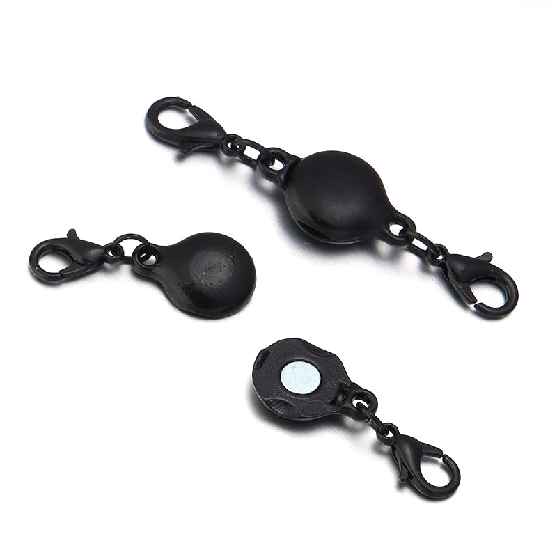 Black magnetic clasps for jewelry making featuring strong metal connectors.
