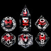 A collection of seven sharp edge resin dice in various shapes and angles, including a pyramid and a dodecahedron.