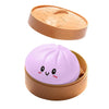 A light purple sensory compress toy in a beige plastic container.