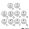 A collection of clear, round squishy stress ball covers with visible screw threads.