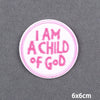 A round pink embroidery patch with the text I AM A CHILD OF GOD in pink thread.