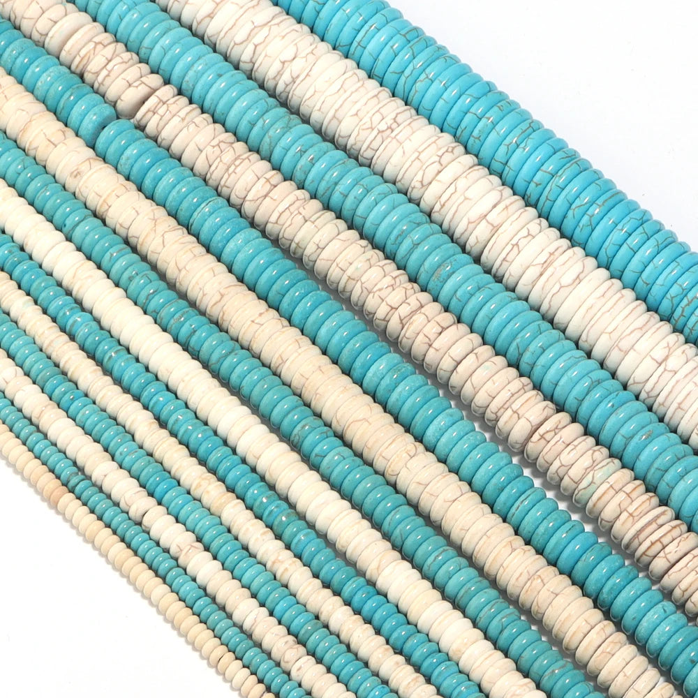 A close-up of multiple strands of natural turquoise stone beads in varying shades of blue and white.