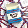 A box of Family Time conversation cards with blue and red accents is shown against a background of scattered cards.
