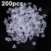 A pile of clear silicone earring backs for secure stud closure.