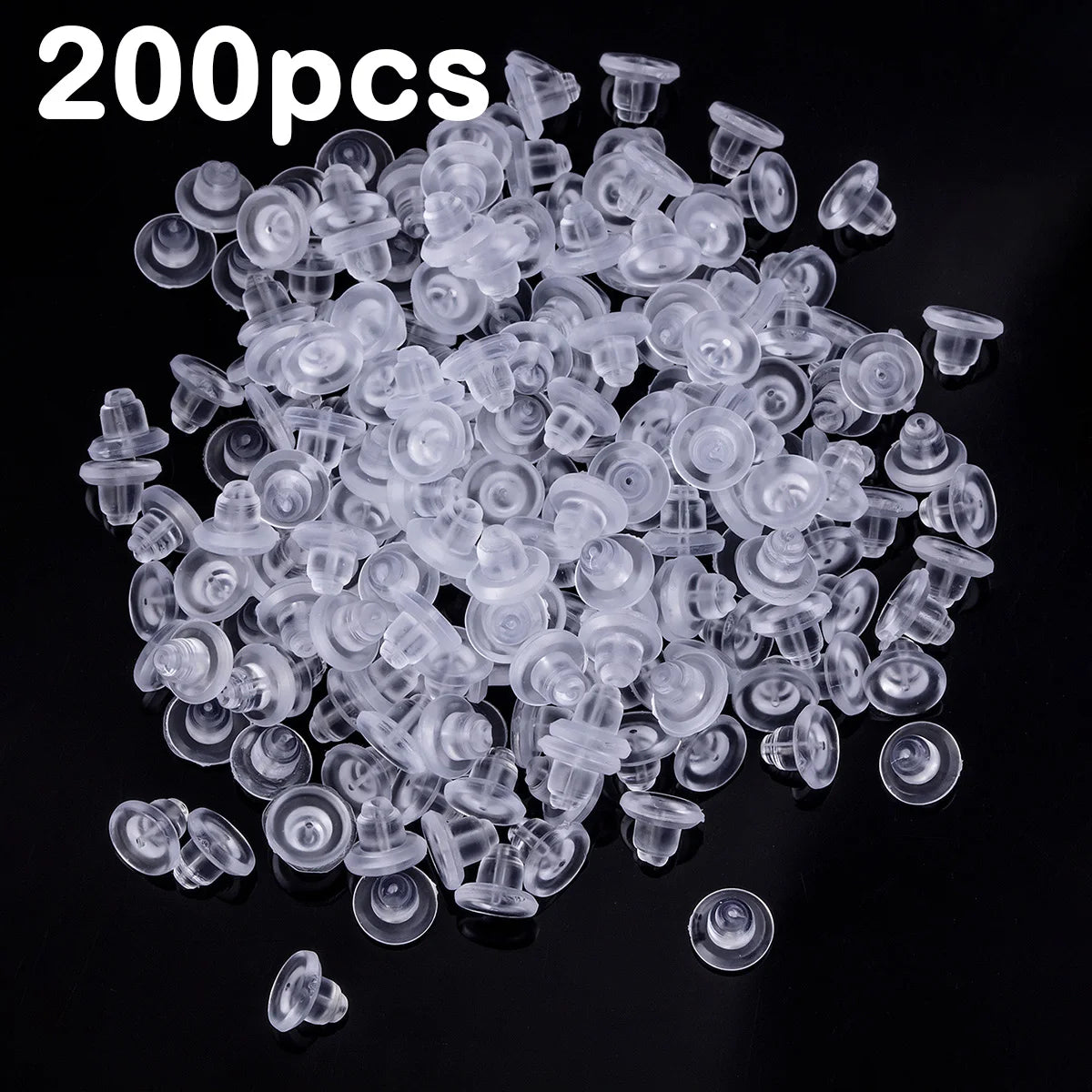 A pile of clear silicone earring backs for secure stud closure.