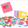 A pink wooden tangram puzzle game with colored pieces scattered on a white surface.