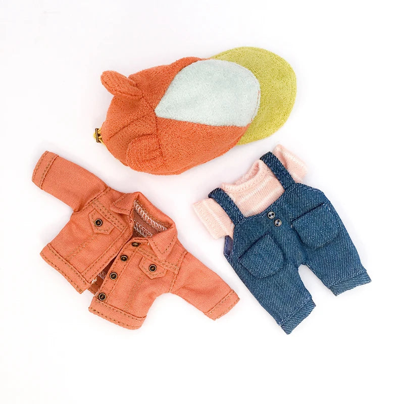 A set of three felt or fabric jackets in orange, green, and denim blue for 1/12 scale dolls.