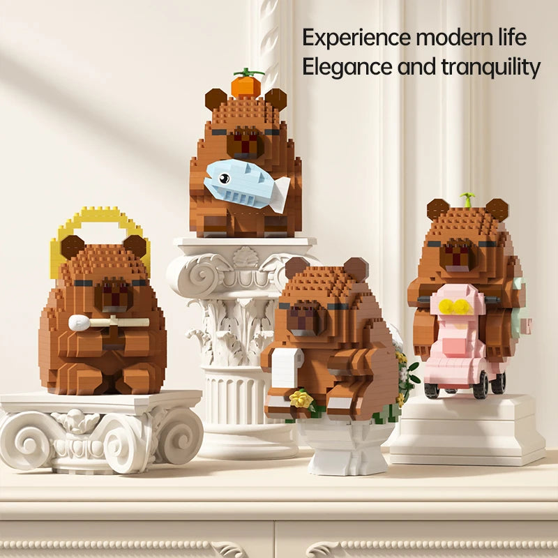 A set of wooden building blocks depicting cute teddy bears and a fish, displayed on a white surface.