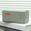 A silver industrial iron storage box with an openable lid resting on a white book.