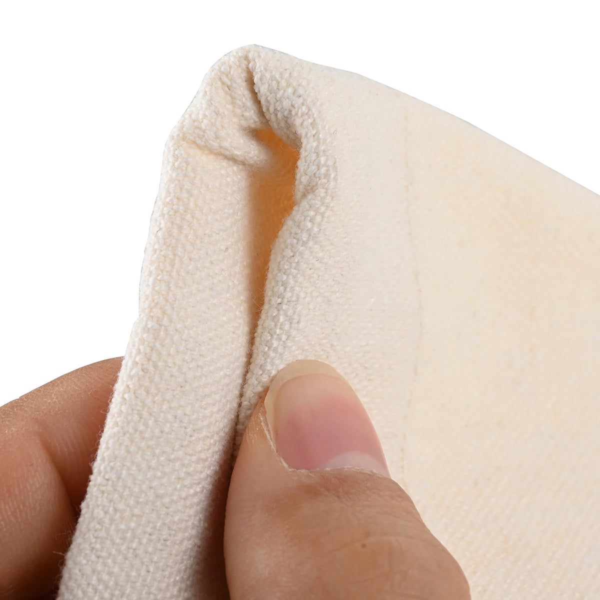 A hand is holding a folded light beige fabric, likely a carry bag for a 12-inch ocean drum.