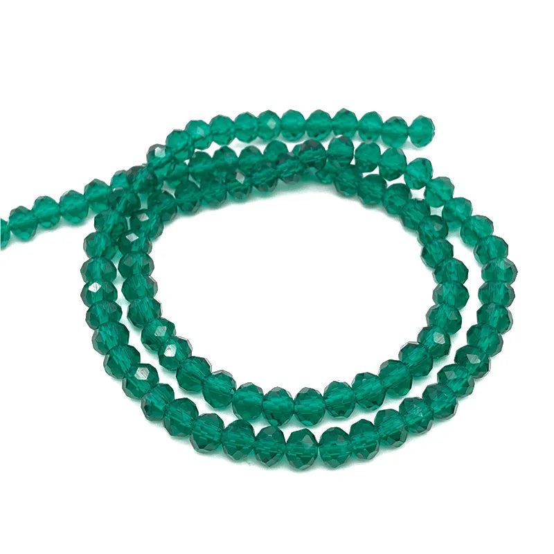 Green faceted crystal beads strung together for jewelry making