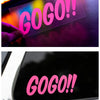 A pink GO GO exclamation decal is shown on a dark surface and a car window.