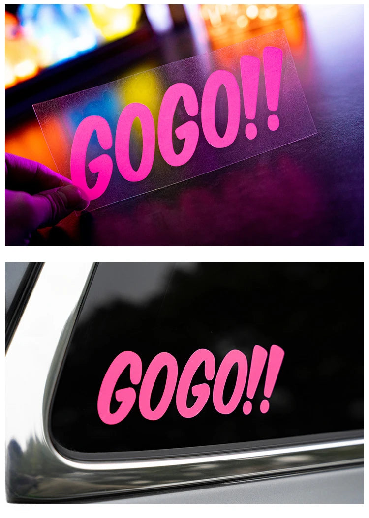 A pink GO GO exclamation decal is shown on a dark surface and a car window.