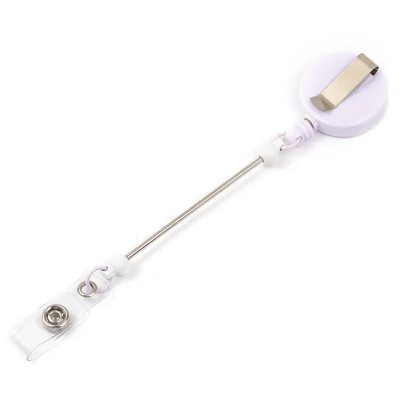 A beadable badge reel with a retractable clip and a decorative ID holder.