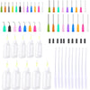 A collection of precision dispensing kit components including various colored needle tips and clear squeeze bottles.