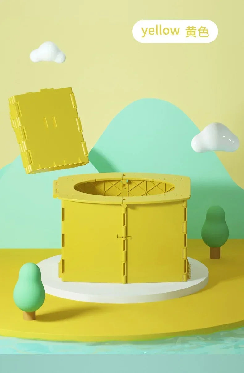 A yellow foldable baby potty training seat is shown on a light green surface with a yellow cloud in the background.