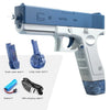 A light blue water blaster gun with a white grip and blue tank, along with a battery and USB charging cable.