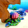 A colorful octopus desktop statue with multiple tentacles and heads is shown against a bright blue background.