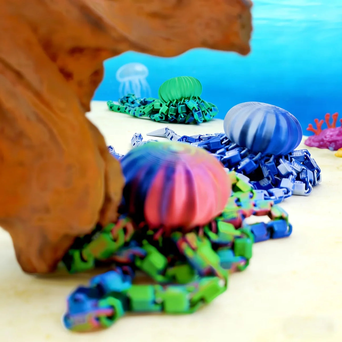 A colorful octopus desktop statue with multiple tentacles and heads is shown against a bright blue background.