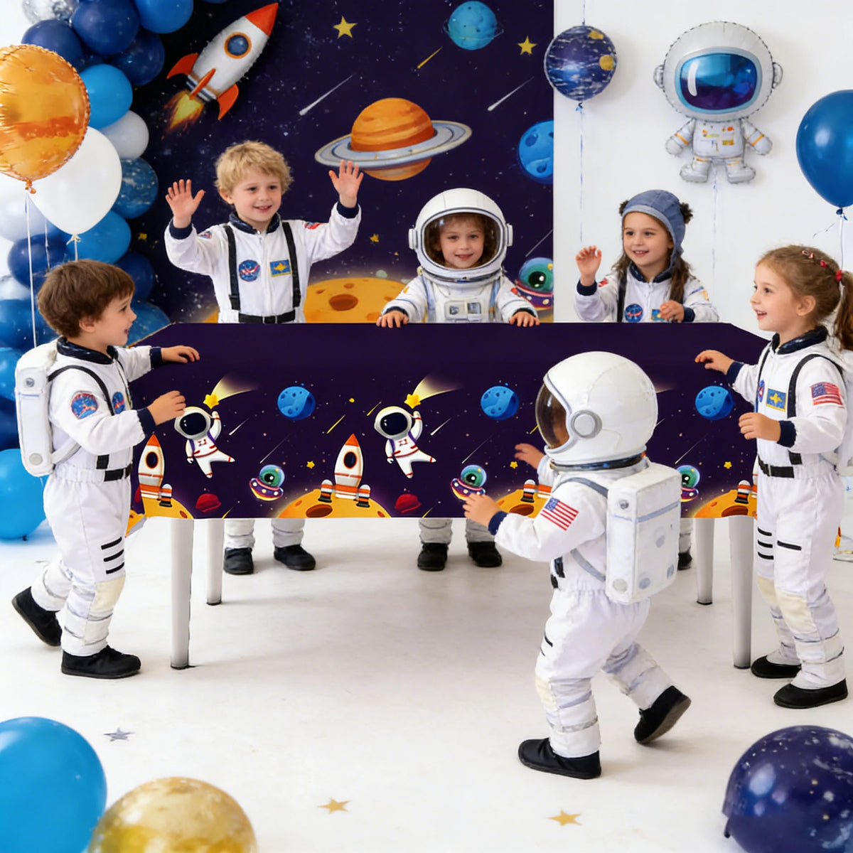 Children dressed as outer space astronauts posing with balloons and space-themed decor
