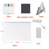 A glowing acrylic message board with a white surface and seven colorful markers, along with accessories.