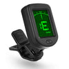 Black clip-on tuner displaying a green E note and tuning indicators for guitar, bass, ukulele, or violin.