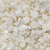 Close-up of clear and iridescent butterfly shell acrylic beads used for DIY jewelry making