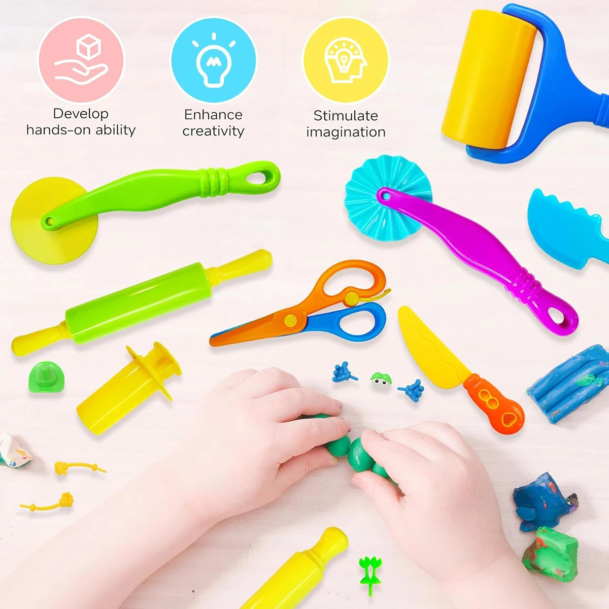 A child's hands are using a complete dough tools kit for kids, including an extruder, rolling pin, and animal cutters.
