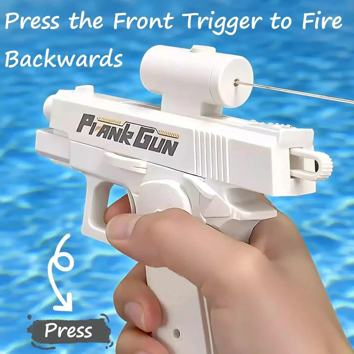 A hand is pressing the front trigger of a white prank gun, which is designed to fire backwards.
