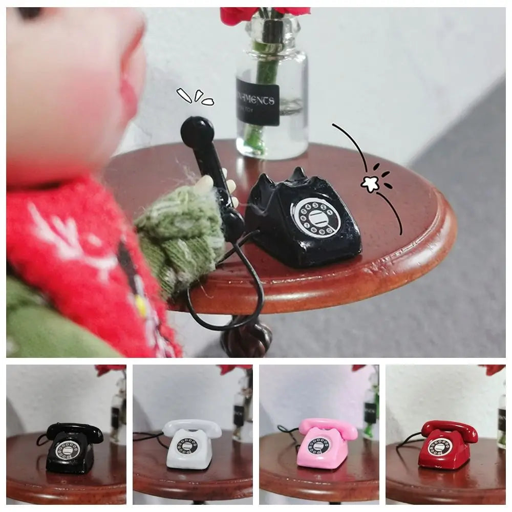 A collection of vintage rotary telephone miniatures in black, white, pink, and red placed on a wooden surface.