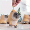 A hand is holding a squishy capybara stress relief toy with realistic fur texture.