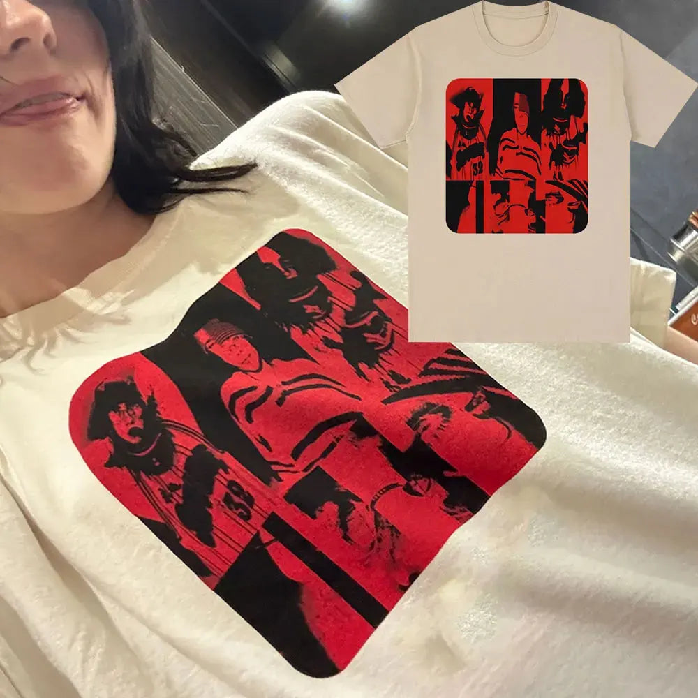 A close-up of a white t-shirt featuring a red graphic print on the chest and a matching design on a separate shirt.