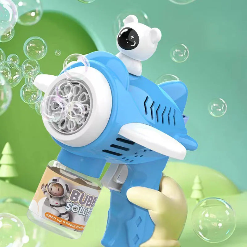A white bear-shaped automatic bubble gun is shown next to a bottle of bubble solution.