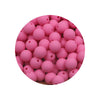 A circular arrangement of pink silicone beads in various sizes for DIY jewelry making