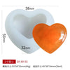 White silicone mold shaped like a heart with an orange silicone insert for DIY crafts