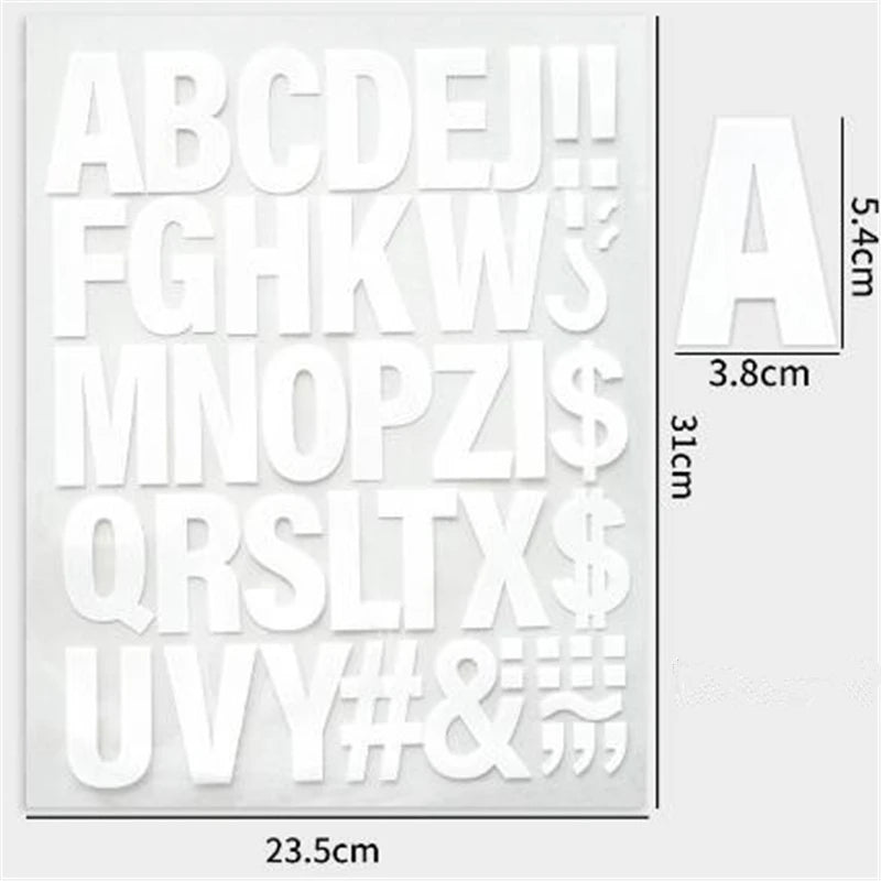 A sheet of white DIY iron-on heat transfer patches showing various uppercase letters and symbols.
