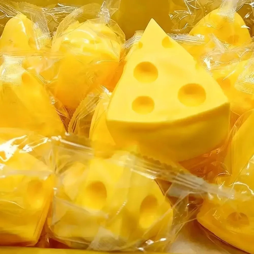 A collection of yellow squishy fidget toys, including a triangular shape, packaged in clear plastic.