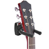 A wall mount guitar hanger with non-slip holder displaying a dark red acoustic guitar neck.