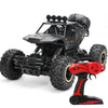 Black high-speed 4WD off-road RC truck with large tires and red light bar