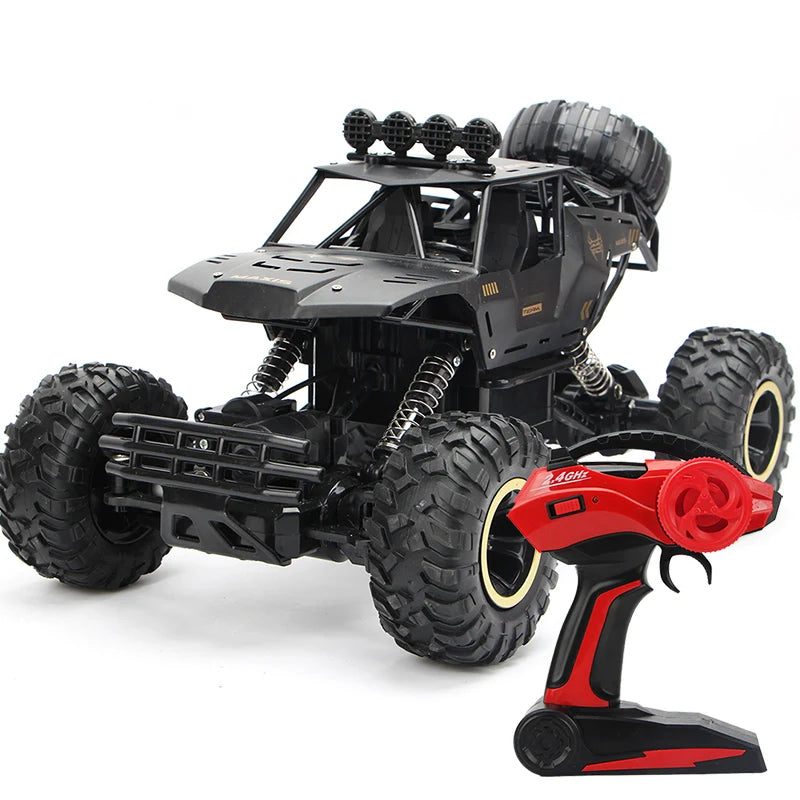 Black high-speed 4WD off-road RC truck with large tires and red light bar