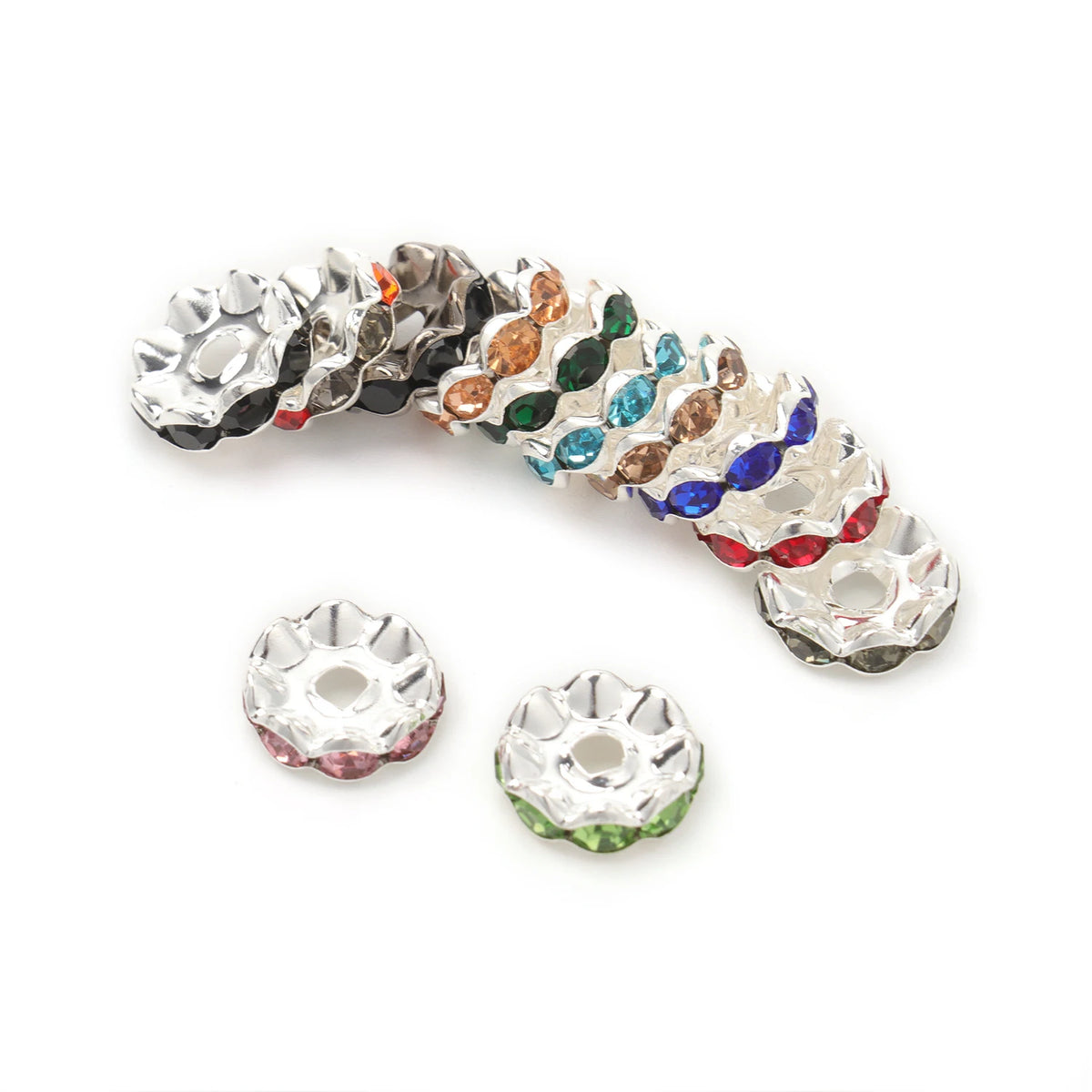 A collection of 12mm crystal rhinestone spacer beads in various colors and cuts for jewelry making.