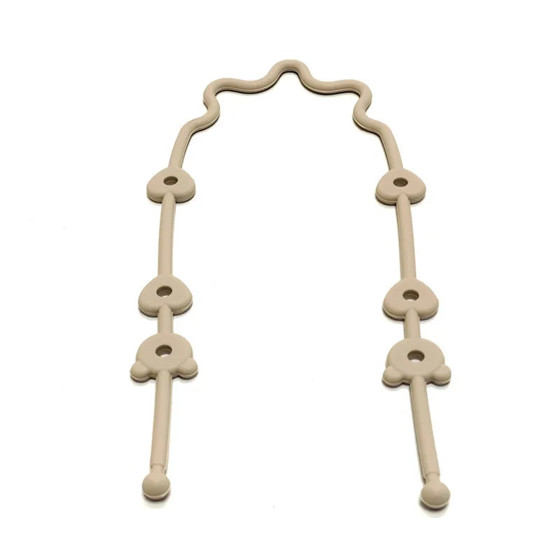 A silicone pacifier clip with an anti-drop chain, light beige in color.