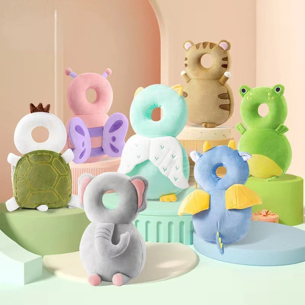A collection of soft security pillows and backpacks in pastel colors, including a bear, elephant, and dinosaur designs.
