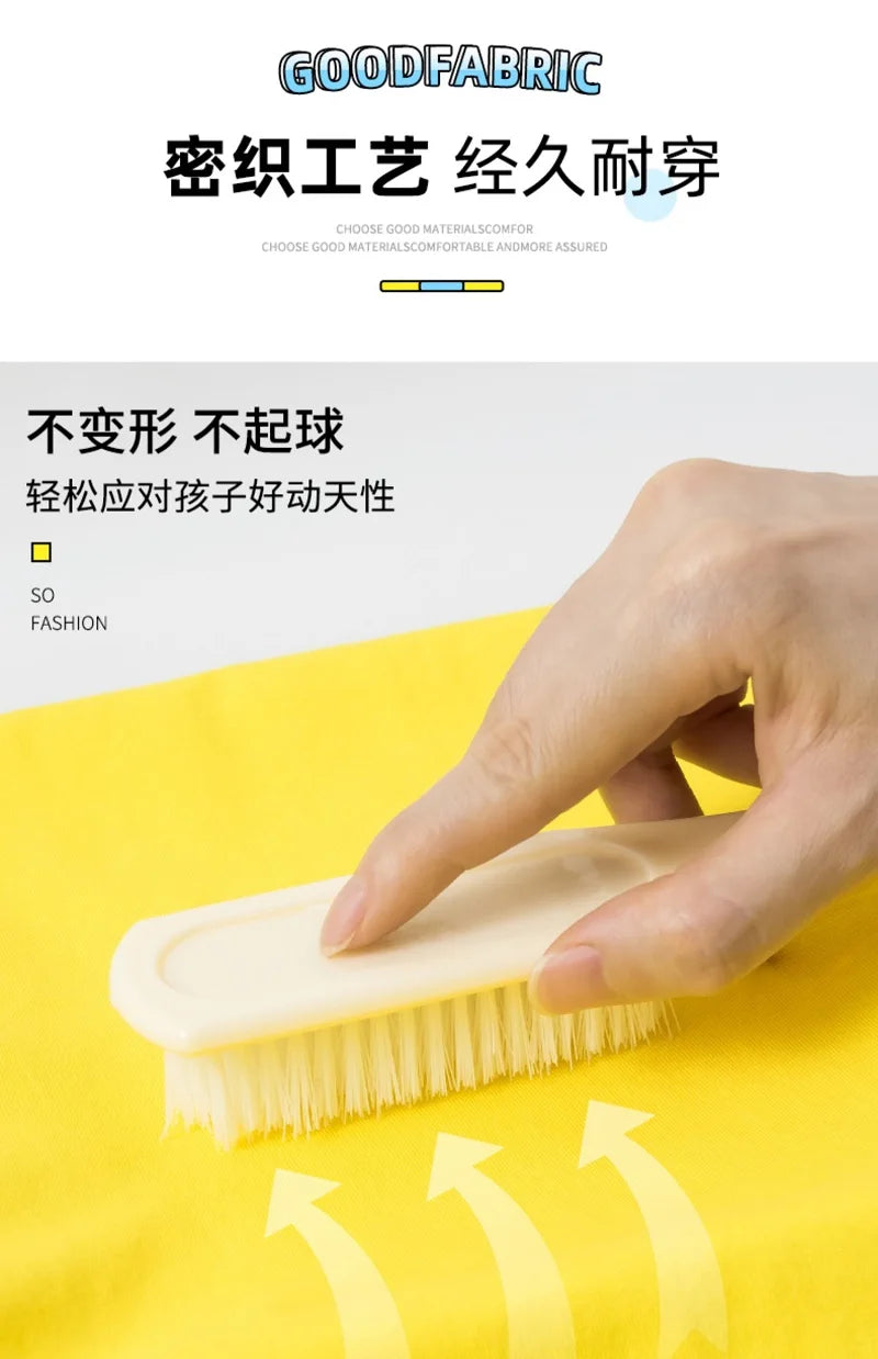 A hand is using a natural-fiber brush on a yellow fabric, demonstrating the durability of the product.