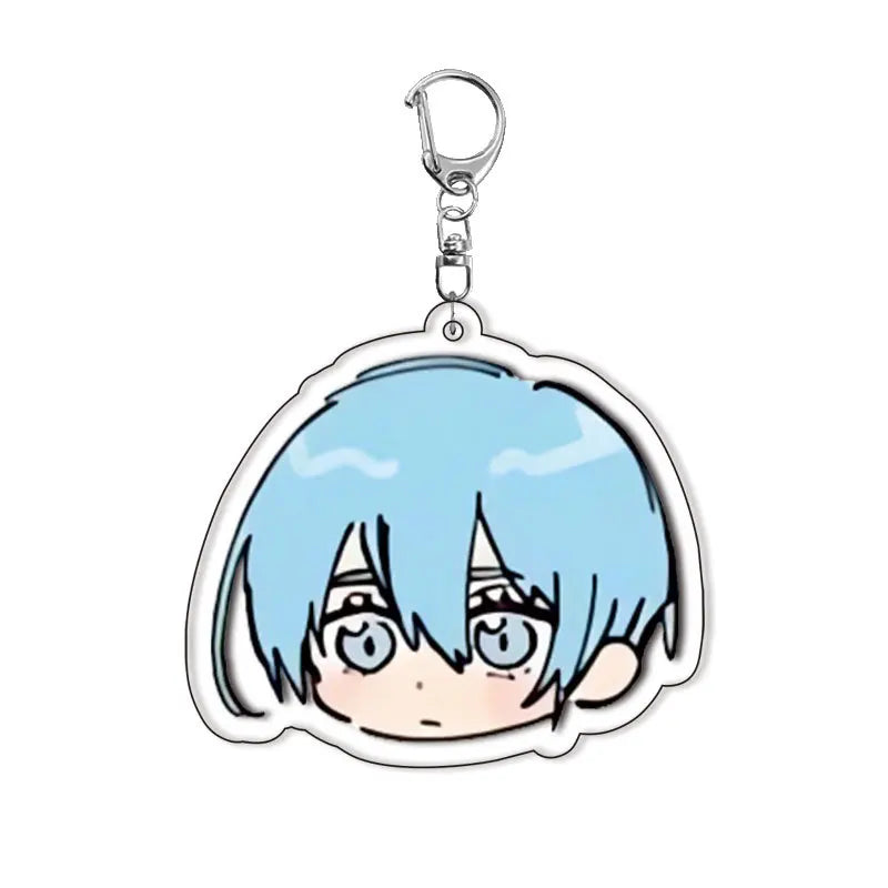 Acrylic keychain set featuring chibi versions of Isagi, Bachira, and Kunigami characters with light blue hair.
