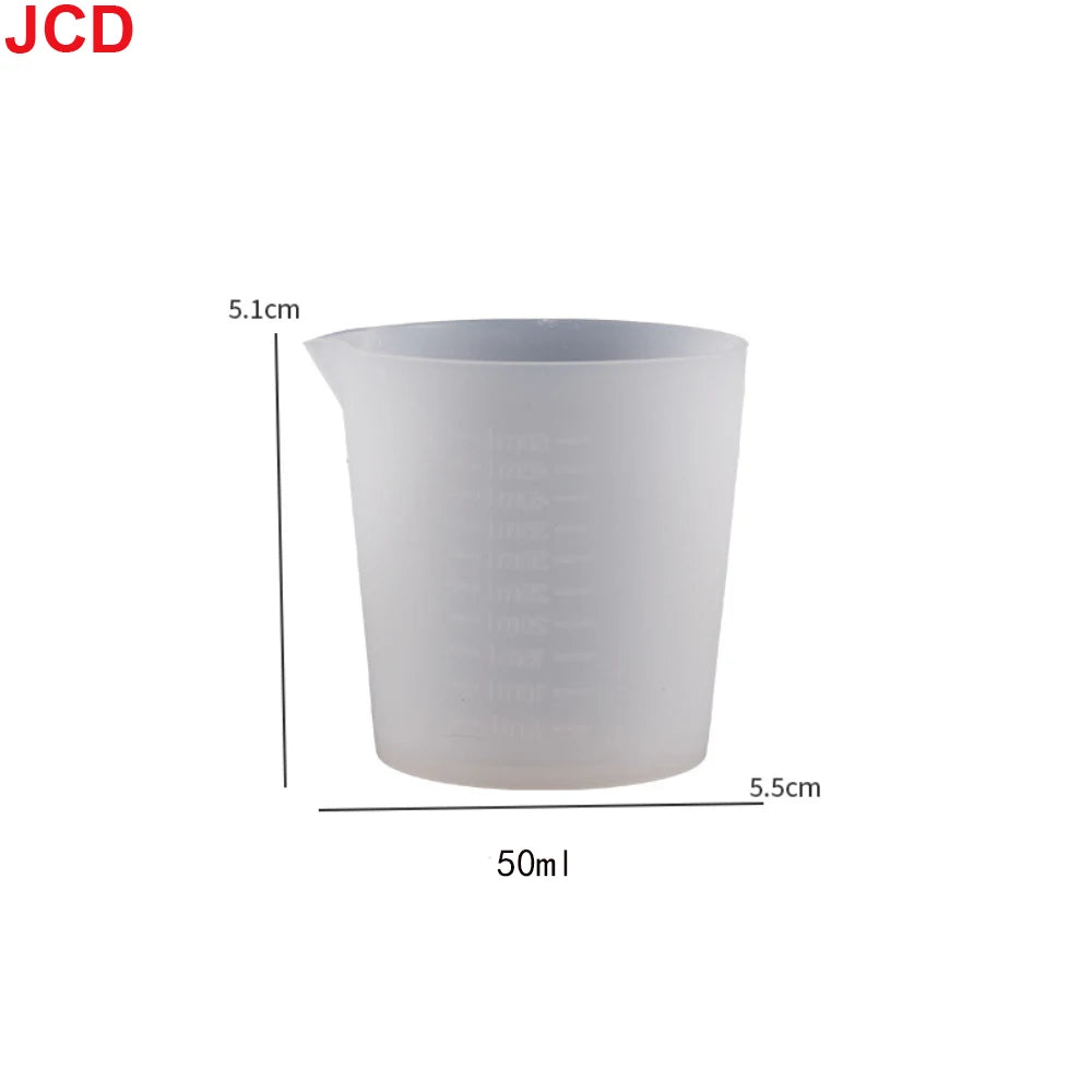 A clear silicone measuring cup with a 5.1cm height and a 50ml capacity.