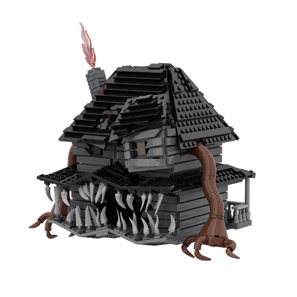 A dark gray haunted house model built from LEGO bricks with a chimney and a menacing facade.